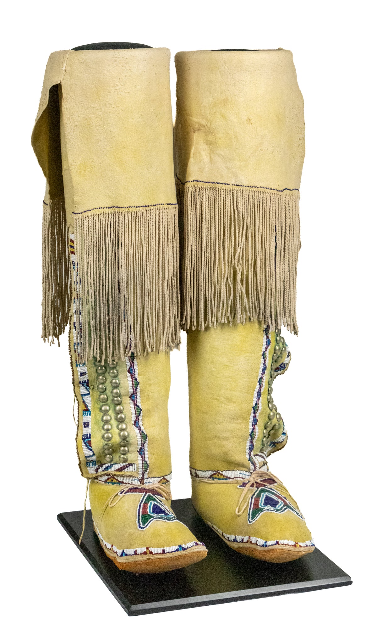 Plains High Top Mocassins, Partially Beaded with Yellow Ochre, Kiowa, circa 1890-1910, brass tacks, glass trade beads, and ochre on hide Moccasins