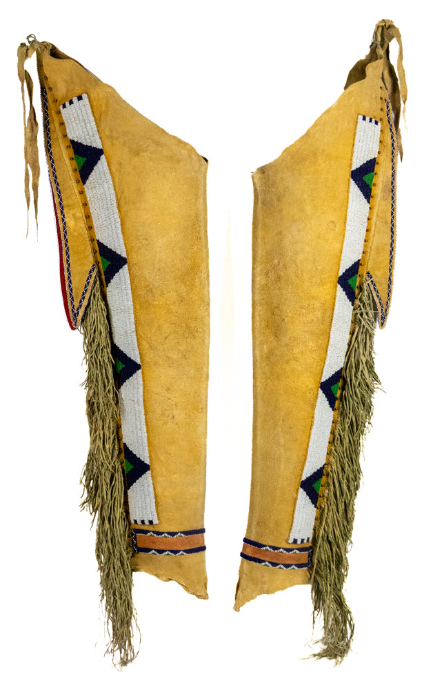 Pair of Jicarilla Apache Beaded Hide Leggings, Late Classic period, Apache, circa 1875, brass tacks, glass trade beads, and ochre on hide Leggings